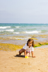 portrait of girl playing on the beach