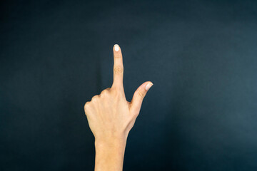 Business woman touching concepts in studio. Business woman pushing on a touch screen interface 