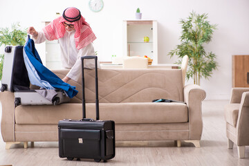 Old arab businessman preparing for business trip