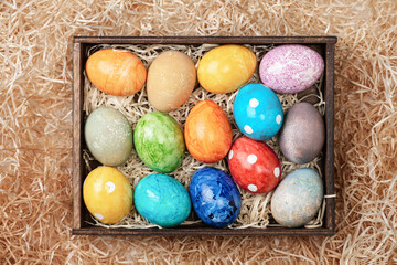Different easter eggs with straw