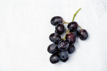 Fresh grapes on a light background - healthy living