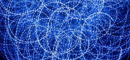 abstract background of led lights, blue neon lamps on the street at night, techno, modern design