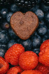 blackberries, blueberries and heart shaped cookie. Breakfast with love. To eat fruit. Love for food. 