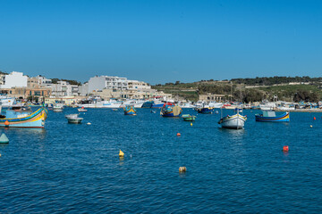 Fototapeta na wymiar Typical Malta Island fishing boat under construction in the fishing village of Marsaxlokk