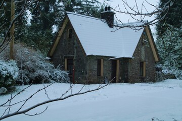 Gatehouse covered in snow in rural setting during winterime 