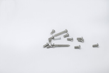Photo shoot of screws on white background. Variety of screws. Product photos.