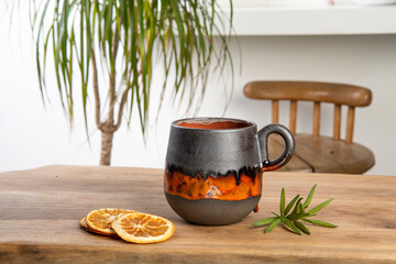 colorful handmade ceramic coffee cup on wooden table