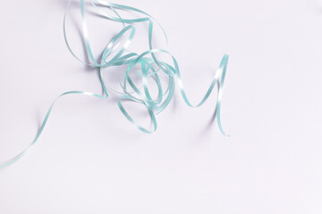 blue ribbon wrapped in a chaotic pile