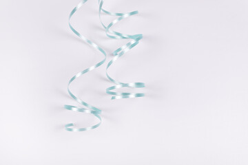 blue ribbon folded into two snakes