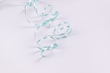 randomly curled blue ribbon in the form of a snake