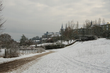 Winter landscape in Bamberg, Germany, on a cloudy day with the famous St. Michaels Monastery in the background