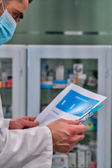 man in facemask with report