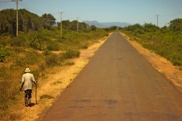 Old African man, on an endless road