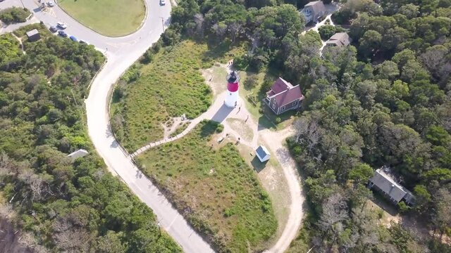 Nauset Lighthouse With Lighthouse Keeper's Home On A Sunny Day In Eastham, Massachusetts. - aerial