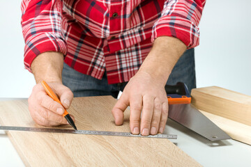 Carpenter measuring plank for the manufacture of the shelf. Do it Yourself concept.