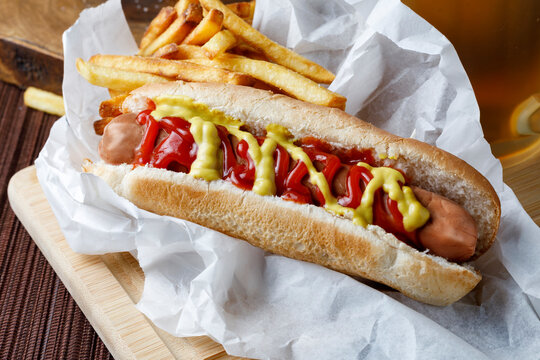 Hot dog with fries and beer