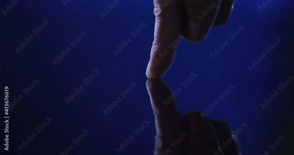 Poster thumb of caucasian man using digital interface applying fingerprint to touchscreen