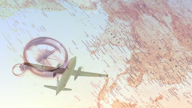 Animation of plane flying over compass and map of asia