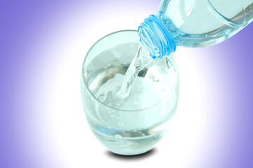 Clean water for good health.  Pouring Fresh Pure Water From Pitcher Into A Glass.