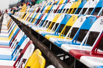 Fototapeta na wymiar Rows of colorful stadium seats
