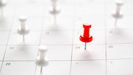 Calendar page pinned in a calender on datebusiness meeting schedule, travel planning or project milestone and reminder concept.