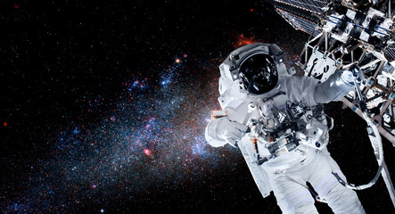 Astronaut spaceman do spacewalk while working for space station in outer space . Astronaut wear full spacesuit for space operation . Elements of this image furnished by NASA space astronaut photos. © InfiniteFlow