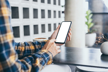 cell phone blank white screen mockup.woman hand holding texting using mobile on desk at office.background empty space for advertise.work people contact marketing business,technology
