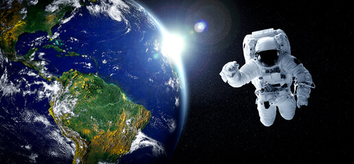 Astronaut spaceman do spacewalk while working for space station in outer space . Astronaut wear full spacesuit for space operation . Elements of this image furnished by NASA space astronaut photos. © InfiniteFlow