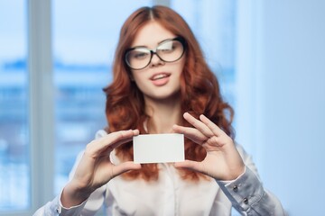 business woman holding a business card office executive financial copy space