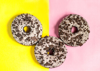 Three donuts on a split colored background