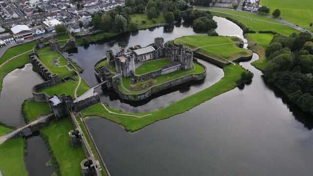 Medieval castle surrounded by moat in Caerphilly, South Wales. Aerial view