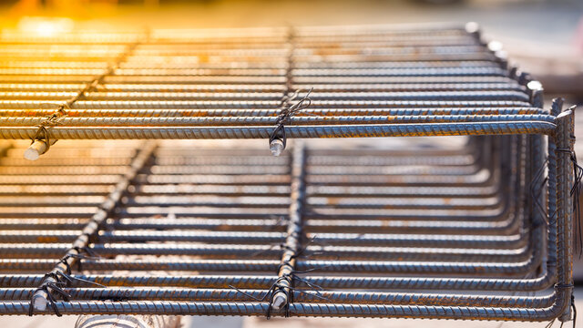 Construction worker Making Reinforcement steel rod and deformed bar with rebar at construction site.