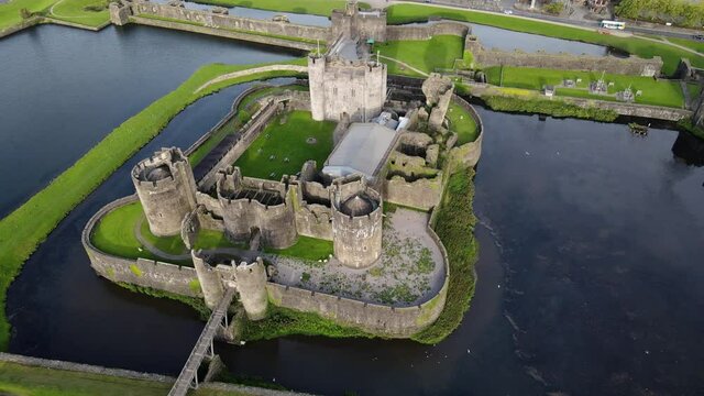 Aerial circling shot of Caerphilly Castle in Southern Wales, United Kingdom