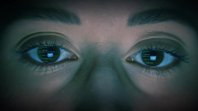 Caucasian female eyes, with blue code scrolling, via reflection of a computer screen, no blinking. We also have more variations of the human eye, for more check out this seller's other videos.