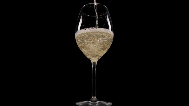 pouring white wine into glass 4k