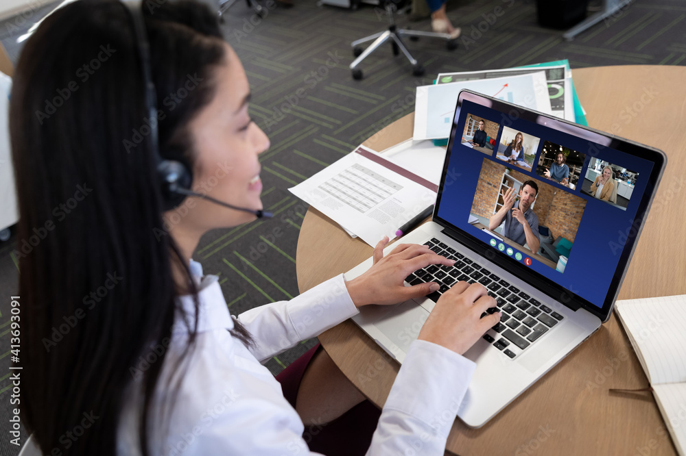 Sticker caucasian woman in office having video call with colleagues displayed on laptop screen