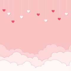 Multiple red and white hearts hanging on pink background