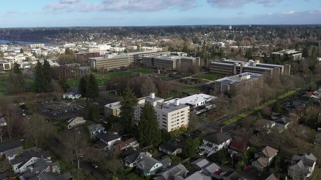 Aerial - drone footage of several Washington State department buildings, East Campus plaza, capitol building campus area and offices in the center of Olympia, Washington.