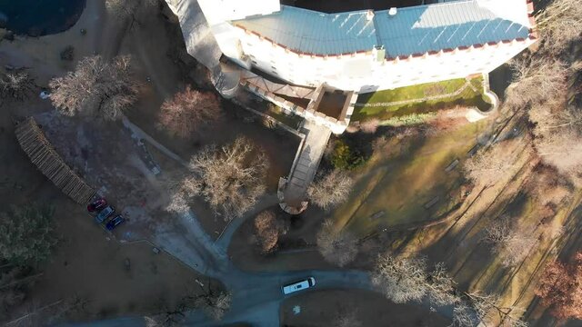 Aerial pan down and rising view over the Lienz Castle in Austria.