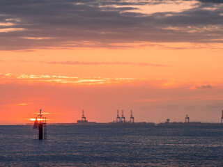Sunrise Over Sea with Port