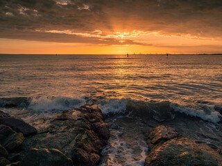 Seaside Sunrise with Rocks and Clouds