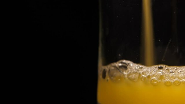 pouring orange juice into glass 4k