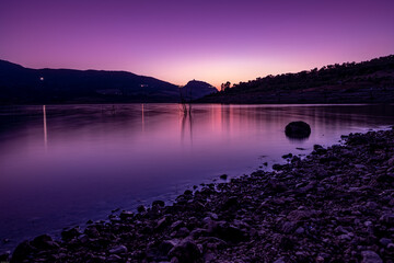 Sunset in a castle over a lake in a calm place