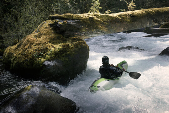 Rear view of kayaker in river