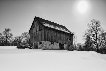 Cold sub zero temperatures of rural landscape scenics featuring barns and outbuildings with magical skies in Southern Ontario Canada.