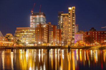 Boston Financial District buildings at night from North Point Park in Cambridge, Massachusetts MA,...