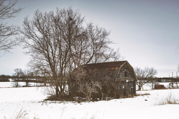 Cold sub zero temperatures of rural landscape scenics featuring barns and outbuildings with magical skies in Southern Ontario Canada.