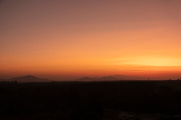 Morning blur over mountains and trees. The first and last light of the day in sky with beautiful