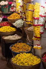 Indian flower vendors selling their garlands and assortment of flowers to locals in a local markets...