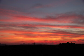 Obraz premium Morning blur over mountains and trees. The first and last light of the day in sky with beautiful